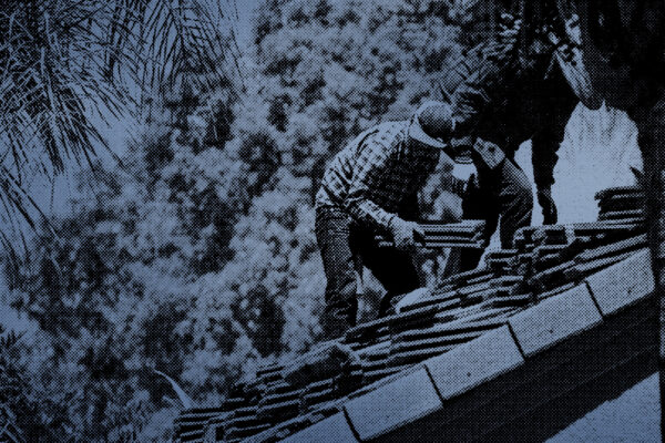 Roofers working on a restoration project they got from an insurance company