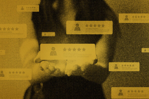 A woman holds five-star reviews and other customer feedback in her hands